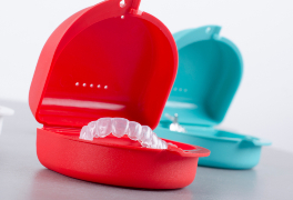 Two mouthguards in cases