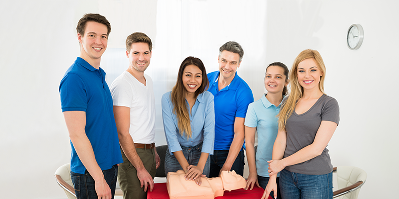 People standing around a table